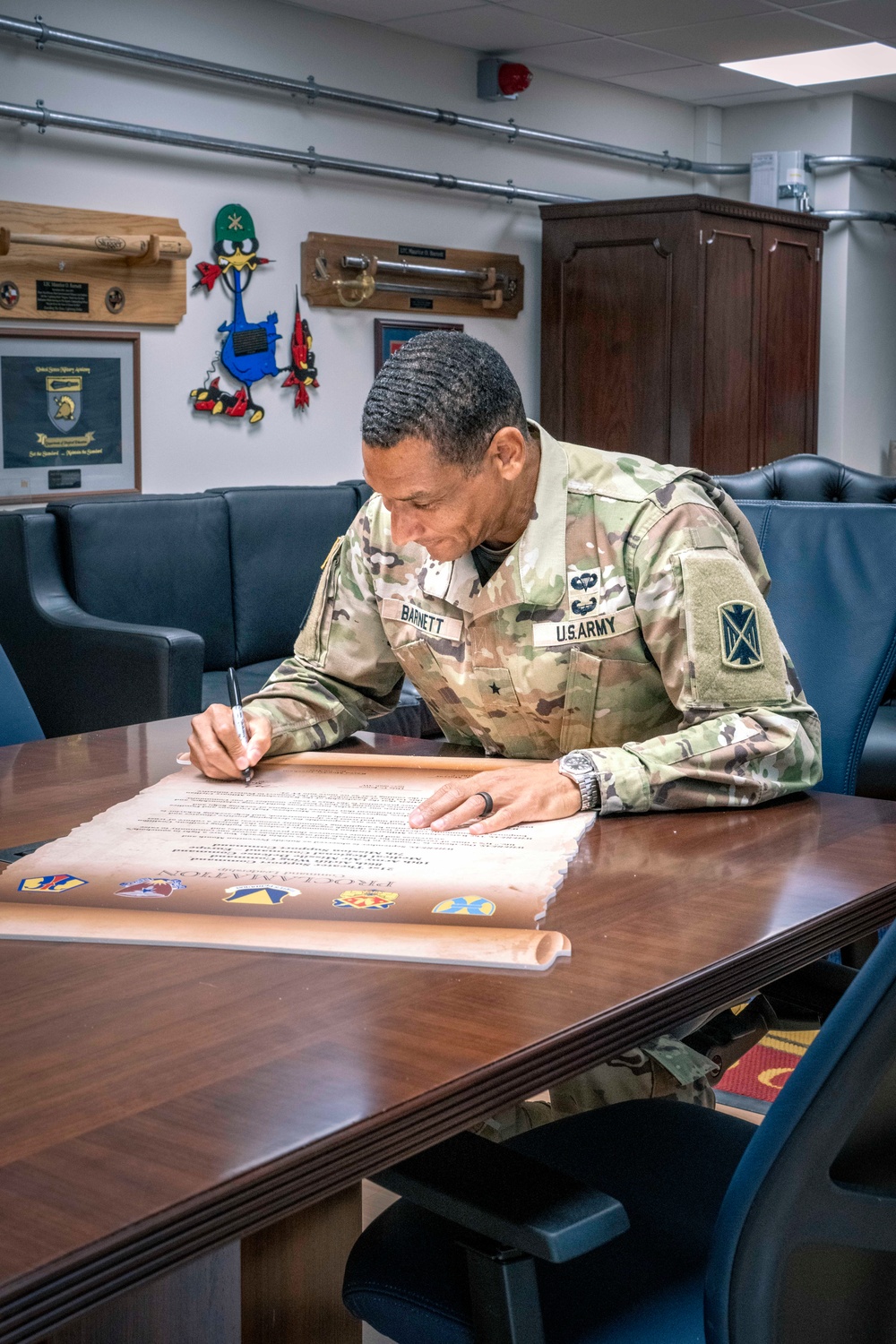 10th AAMDC commanding general signs proclamation for Suicide Prevention Month