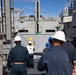 USS Ralph Johnson conducts a replenishment-at-sea with the USNS Matthew Perry.