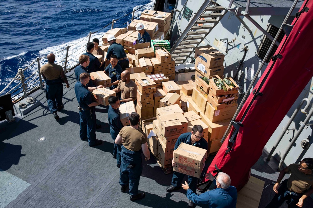 USS Ralph Johnson conducts a replenishment-at-sea with the USNS Matthew Perry.