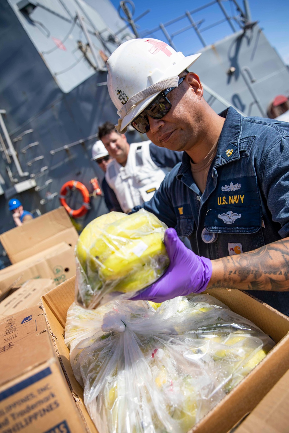 USS Ralph Johnson conducts a replenishment-at-sea with the USNS Matthew Perry.