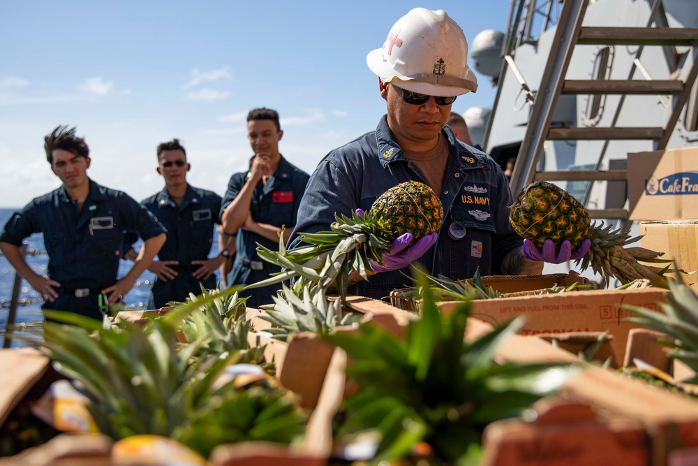 USS Ralph Johnson conducts a replenishment-at-sea with the USNS Matthew Perry.