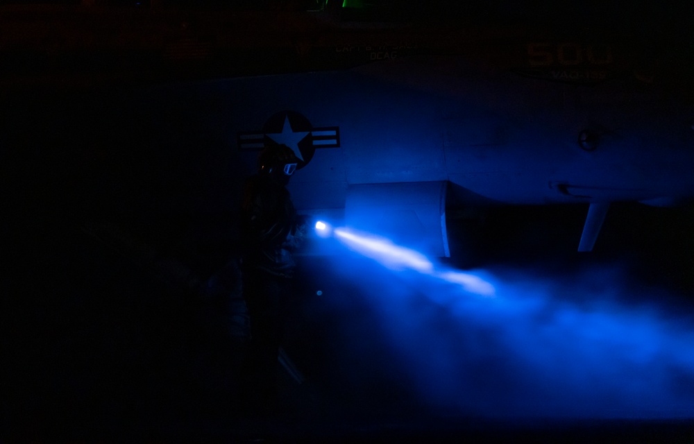 Sailor Inspects Aircraft