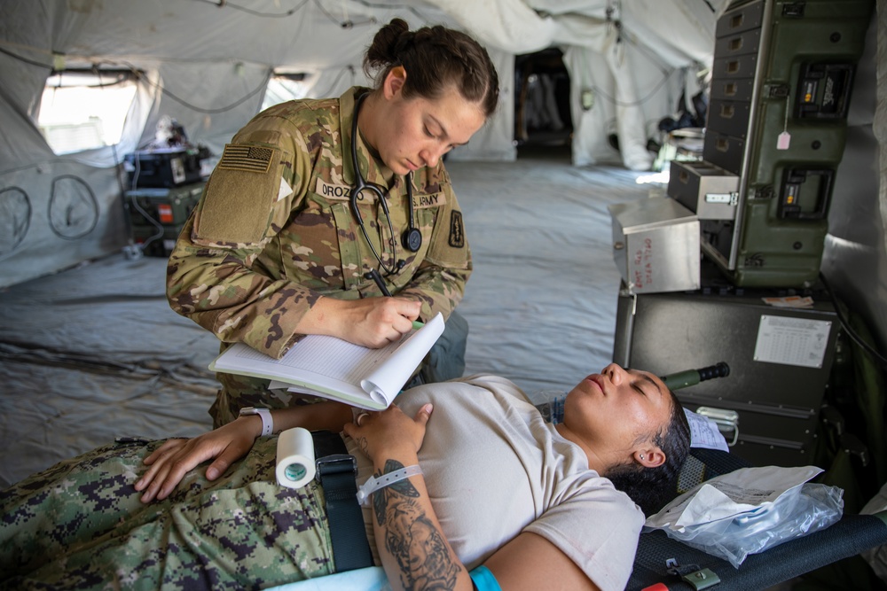 Medical personnel react and treat patients from notional attacks during Combat Support Training Exercise