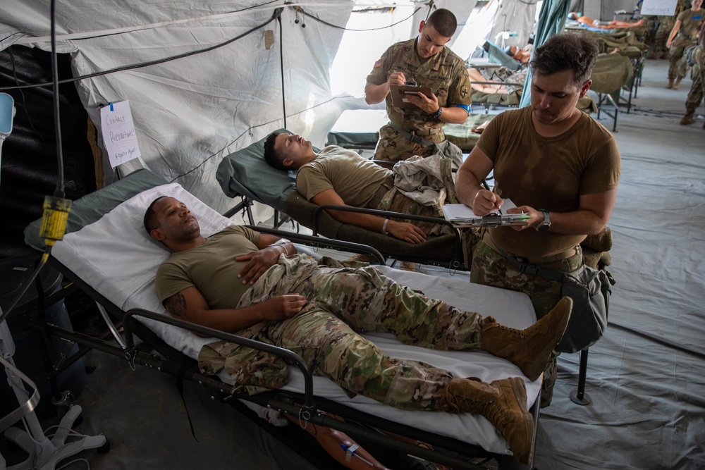 Medical personnel react and treat patients from notional attacks during Combat Support Training Exercise