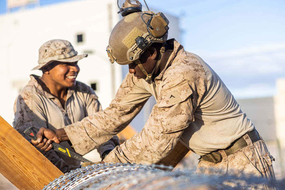 Marines with 3/7, 1st Combat Engineer Battalion defend an urban environment during AFX 5-23