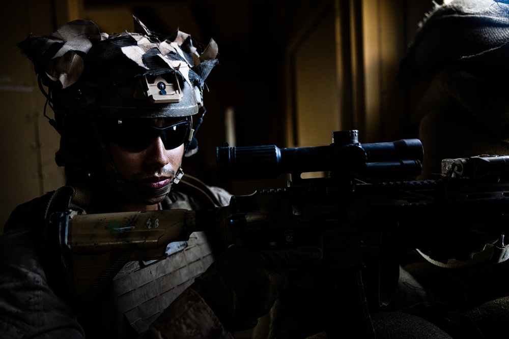 Marines with 3/7, 1st Combat Engineer Battalion defend an urban environment during AFX 5-23