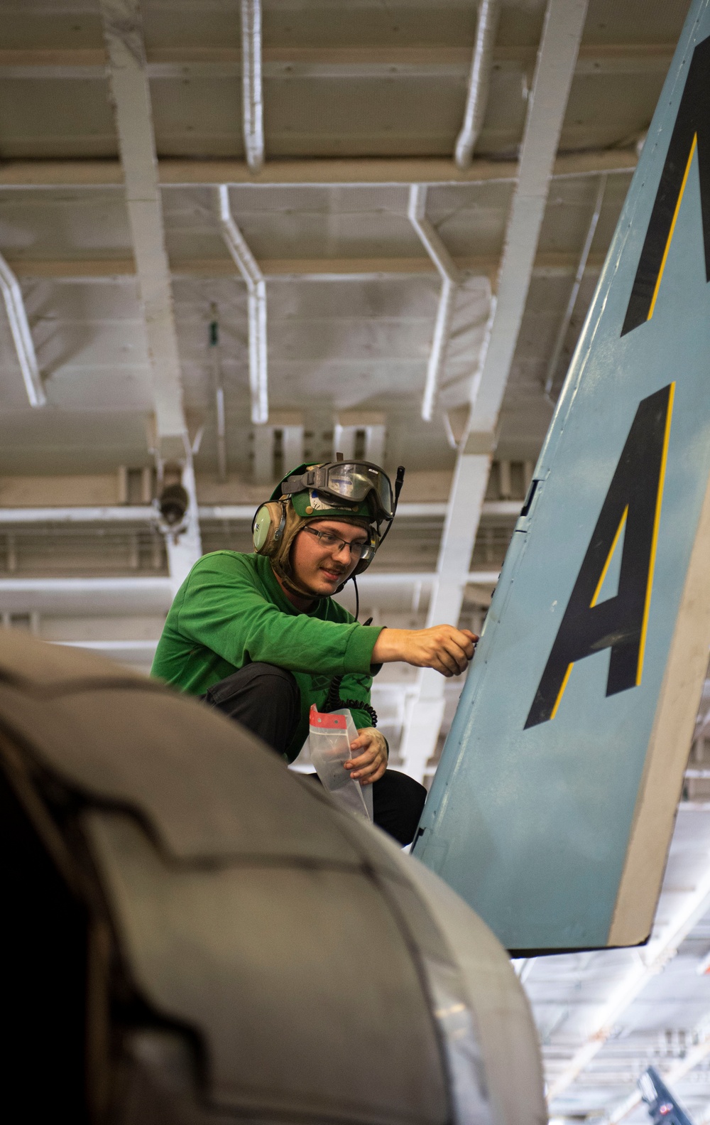 Sailor Performs Maintenance