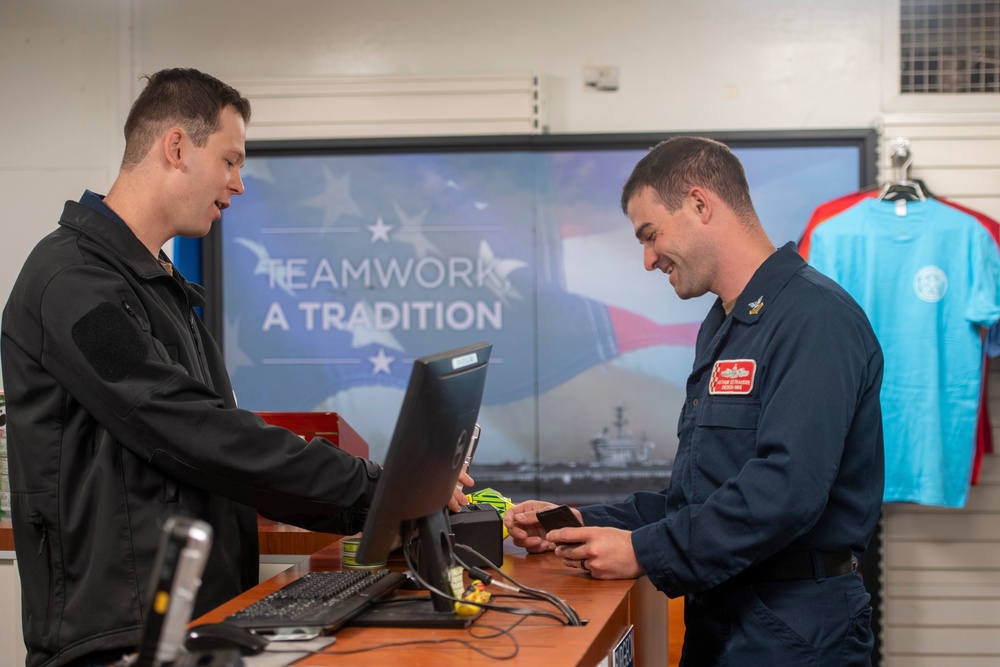 U.S. Navy Sailor Completes A Transaction