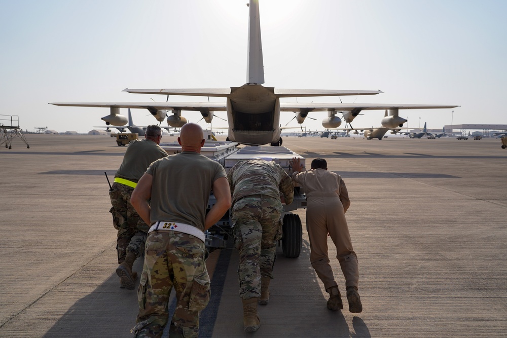 378th ELRS and RSAF load C-130 in preparation for Operation Agile Spartan