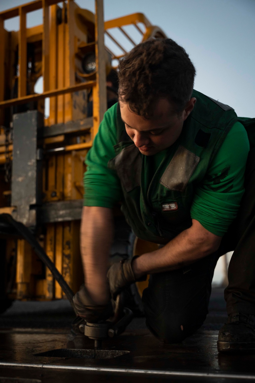 USS Carl Vinson (CVN 70) Sailors Perform Maintenance on the Flight Deck in the Pacific Ocean