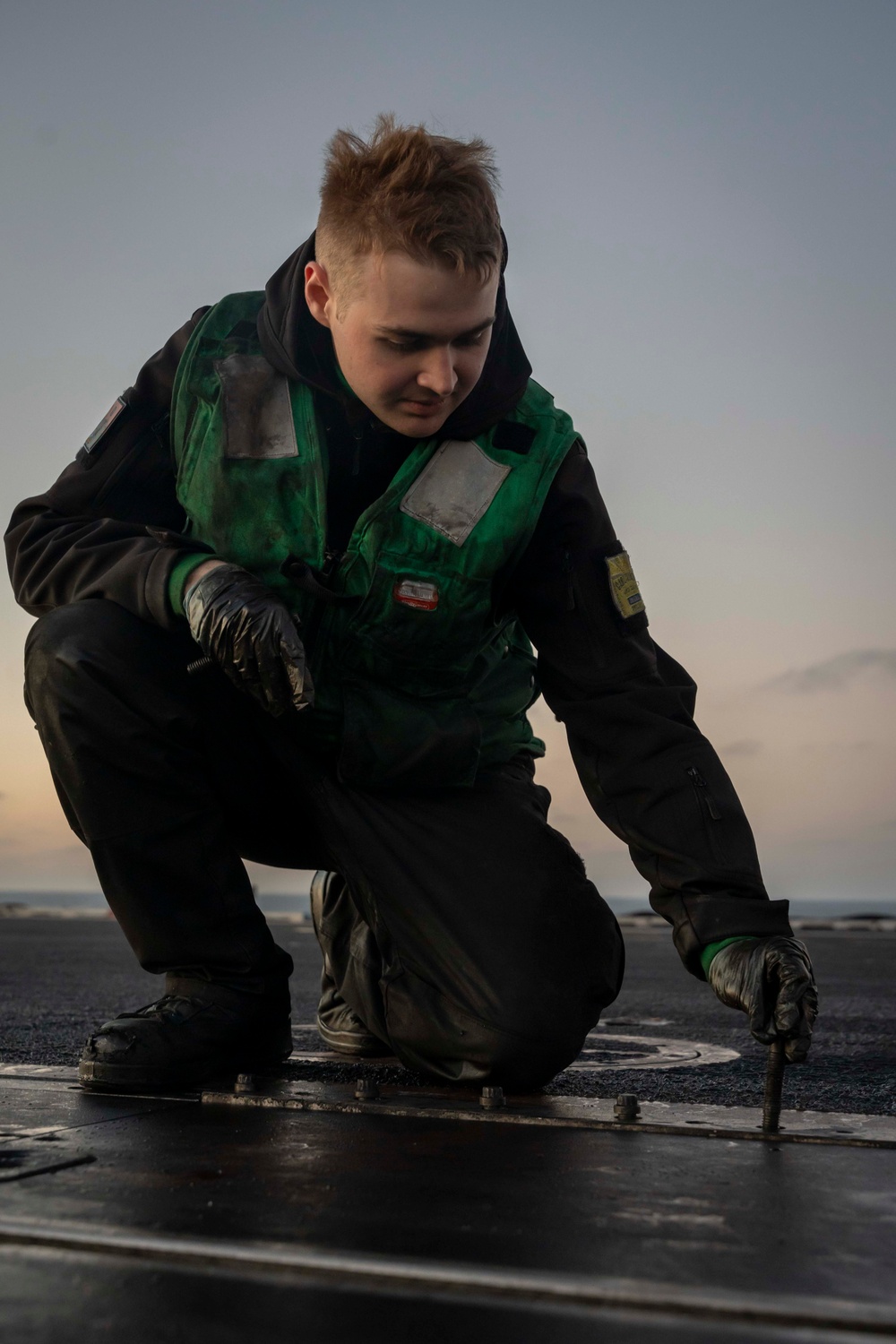 USS Carl Vinson (CVN 70) Sailors Perform Maintenance on the Flight Deck in the Pacific Ocean