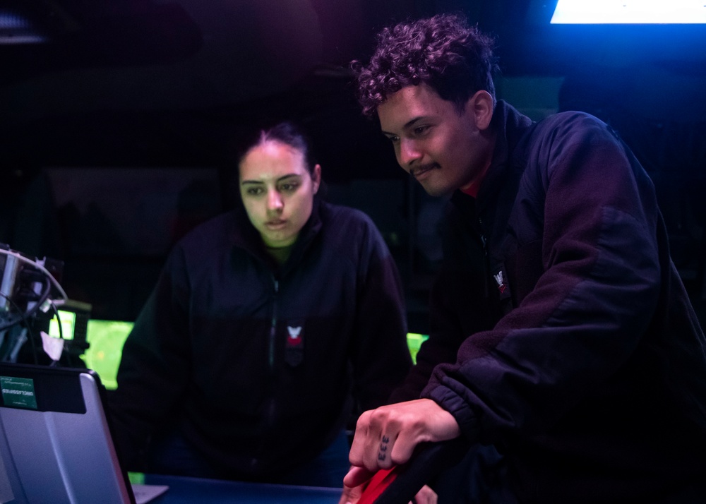 Sailors Stand Watch in the Combat Information Center aboard USS John Finn (DDG 113), Aug. 10