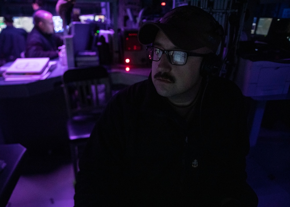 Sailors Stand Watch in the Combat Information Center aboard USS John Finn (DDG 113), Aug. 10