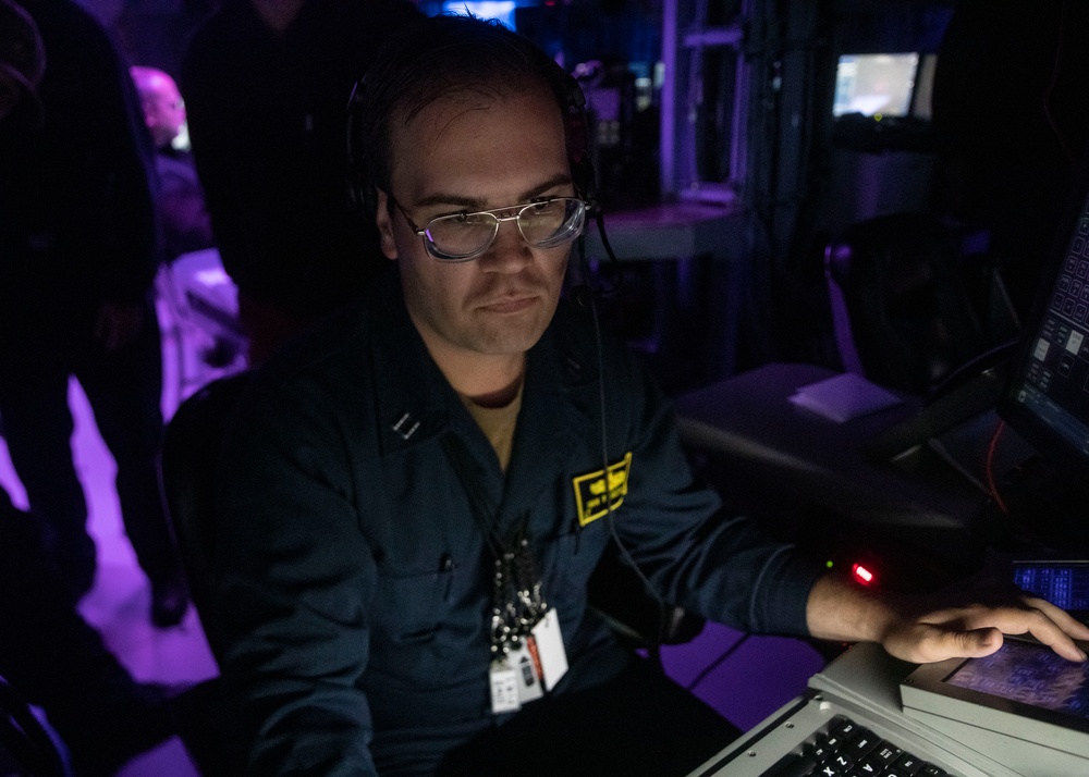 Sailors Stand Watch in the Combat Information Center aboard USS John Finn (DDG 113), Aug. 10