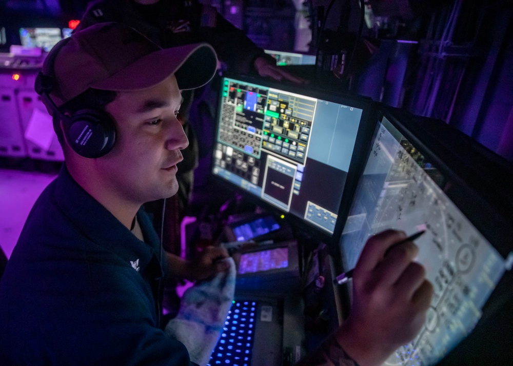 Sailors Stand Watch in the Combat Information Center aboard USS John Finn (DDG 113), Aug. 10