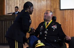 Wounded warrior receives one of the highest military police honors