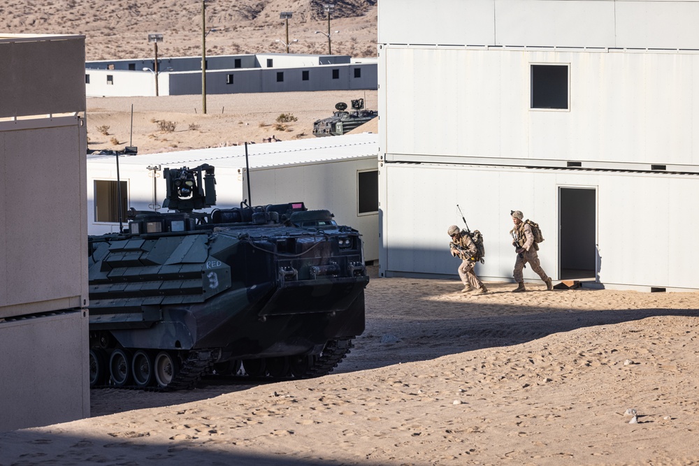 Marines with 3/7, 3rd AAB, 1st CEB conduct a mechanized assault on an urban environment during AFX 5-23