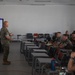 Division gunner briefs officers on weapons, equipment during company commander course