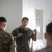 Division gunner briefs officers on weapons, equipment during company commander course