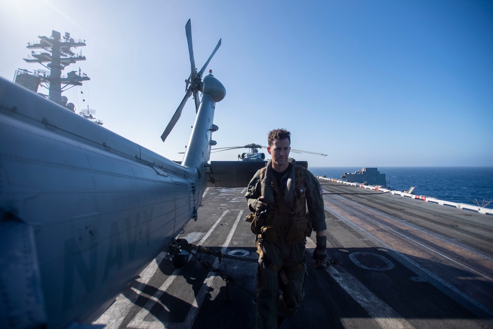 U.S. Navy Sailor Preforms Preflight Checks