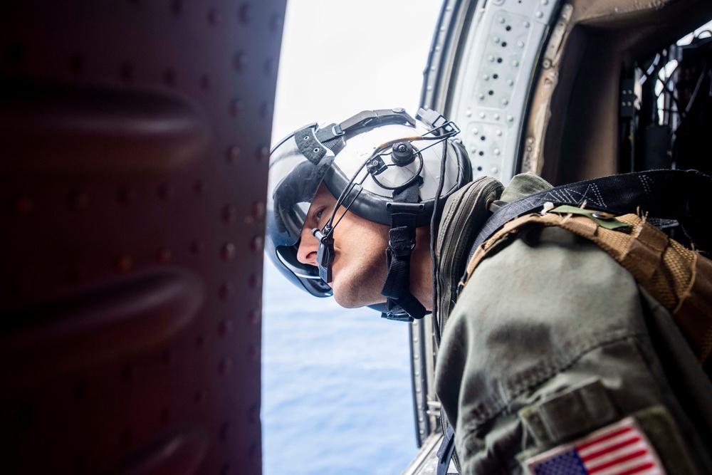 U.S. Navy Sailor Preforms Lookout Duties