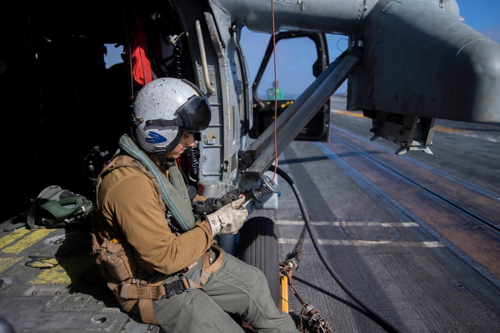 U.S. Navy Sailor Performs Preflight Checks