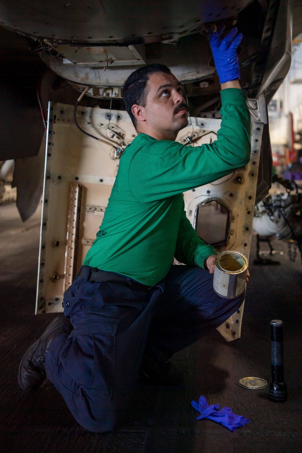 Sailor Conducts Maintenance