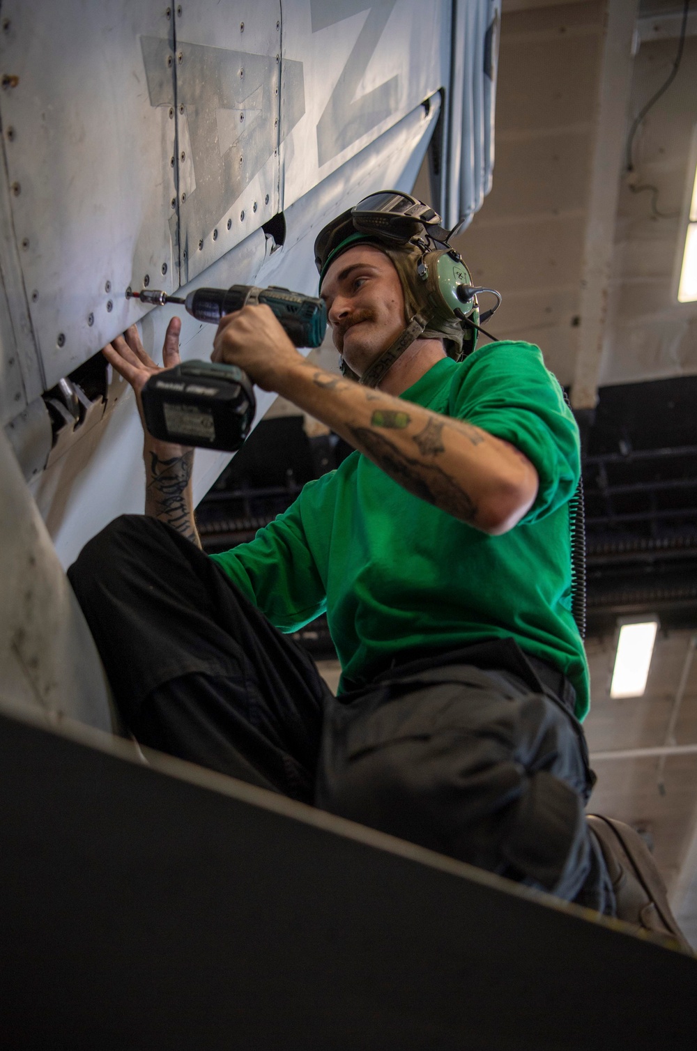 Sailor Conducts Maintenance