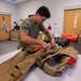 Aircrew flight equipment technician repacks a BA-30 Low Profile parachute