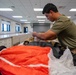 Aircrew flight equipment technician repacks a BA-30 Low Profile parachute