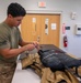 Aircrew flight equipment technician repacks a BA-30 Low Profile parachute