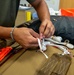 Aircrew flight equipment technician repacks a BA-30 Low Profile parachute