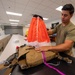 Aircrew flight equipment technician repacks a BA-30 Low Profile parachute