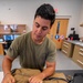 Aircrew flight equipment technician repacks a BA-30 Low Profile parachute