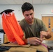 Aircrew flight equipment technician repacks a BA-30 Low Profile parachute