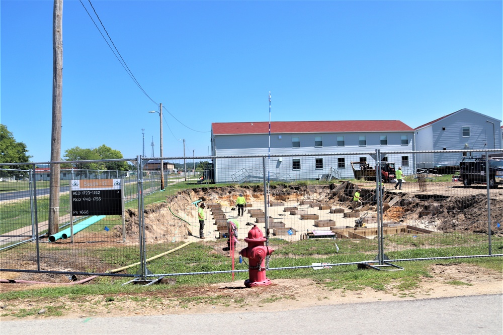 Work to build new foundations for relocated World War II-era barracks under way at Fort McCoy