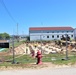 Work to build new foundations for relocated World War II-era barracks under way at Fort McCoy