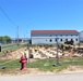 Work to build new foundations for relocated World War II-era barracks under way at Fort McCoy