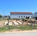 Work to build new foundations for relocated World War II-era barracks under way at Fort McCoy