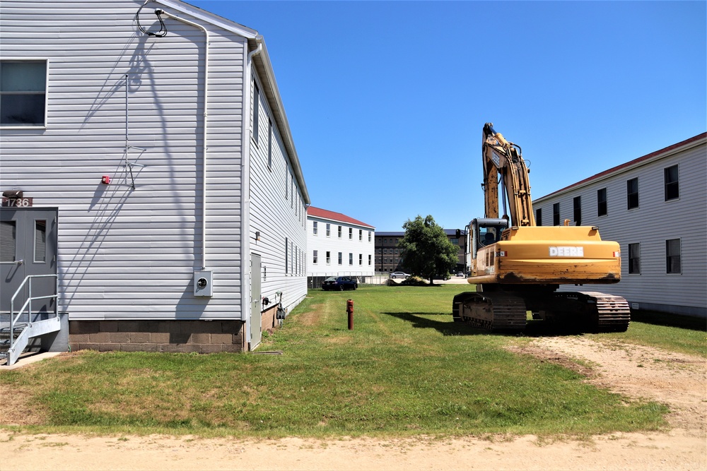 Work to build new foundations for relocated World War II-era barracks under way at Fort McCoy