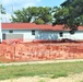 Work to build new foundations for relocated World War II-era barracks under way at Fort McCoy