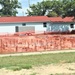 Work to build new foundations for relocated World War II-era barracks under way at Fort McCoy