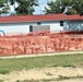 Work to build new foundations for relocated World War II-era barracks under way at Fort McCoy