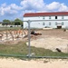 Work to build new foundations for relocated World War II-era barracks under way at Fort McCoy