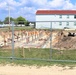 Work to build new foundations for relocated World War II-era barracks under way at Fort McCoy