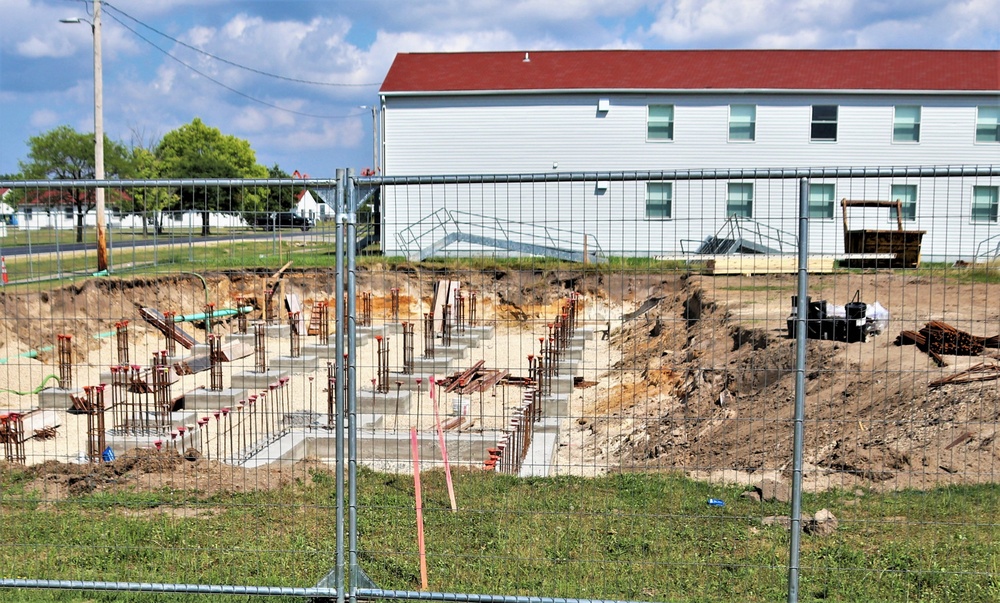 Work to build new foundations for relocated World War II-era barracks under way at Fort McCoy