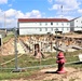 Work to build new foundations for relocated World War II-era barracks under way at Fort McCoy