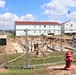 Work to build new foundations for relocated World War II-era barracks under way at Fort McCoy