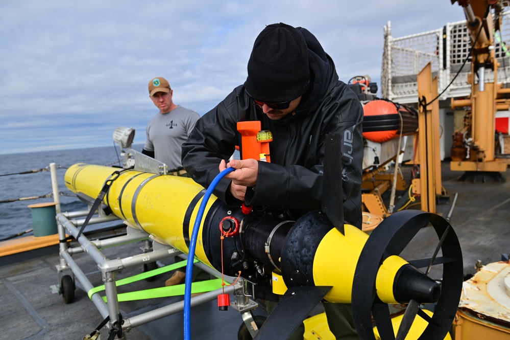 U.S. Navy launches an unmanned undersea vehicle from a Coast Guard Cutter in support of Op Nanook