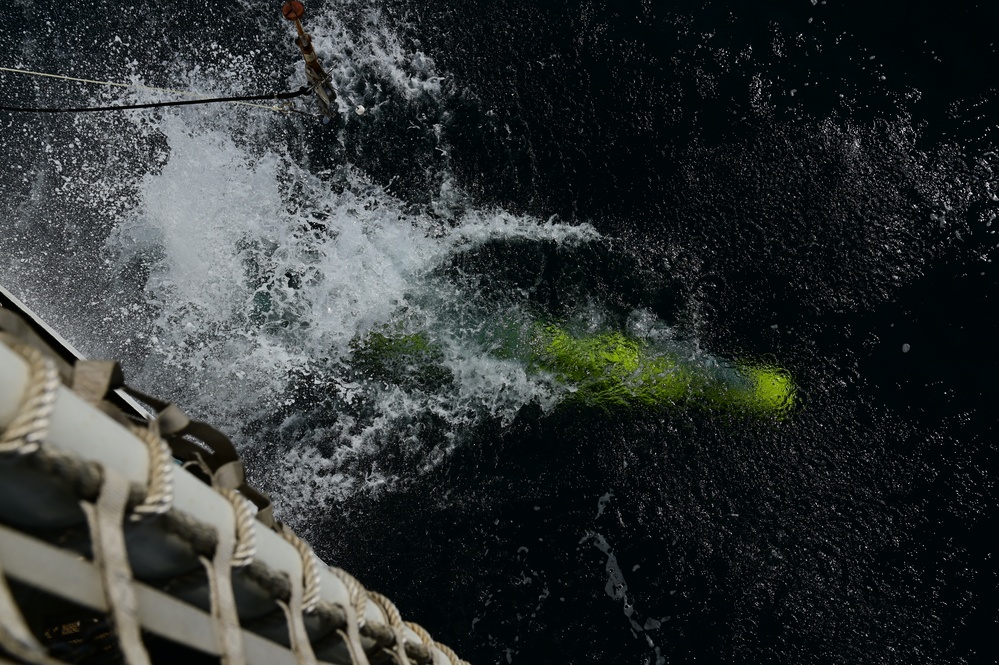 U.S. Navy launches an unmanned undersea vehicle from a Coast Guard Cutter in support of Op Nanook